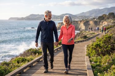 image of an attractive couple walking for good health