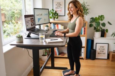 woman working from home on standing computer workstation