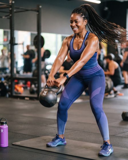 African American woman working out with a kettle bell